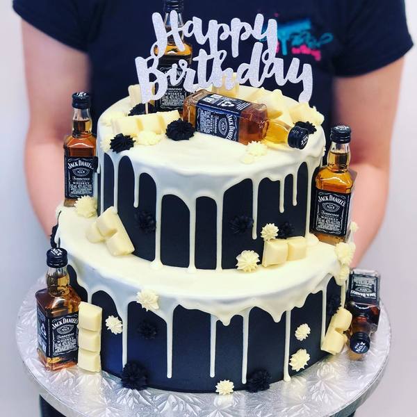 Two Tier Black and Cream Jack Daniels Cake