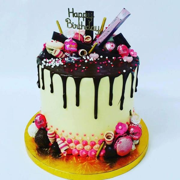 Smooth Cream and Pink Cake with Chocolate Drip and Toppings