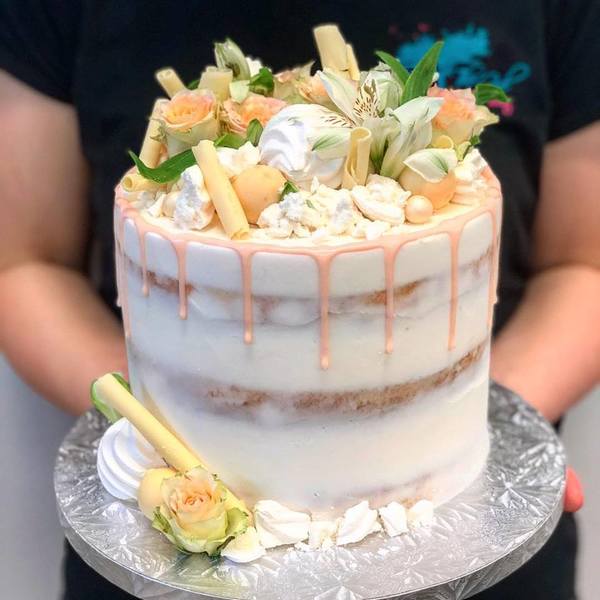 Naked Cake with Peach Drip and Fresh Flowers