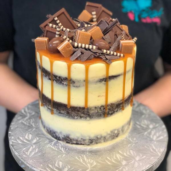 Naked Cake with Caramel Drip and Chocolate and Caramel Toppings