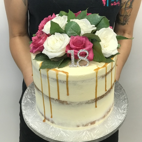 Cream Naked Cake With Caramel Drip and Fresh Flowers 