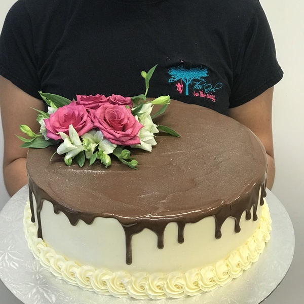 Smooth Cream with Chocolate Drip and Fresh Flowers 