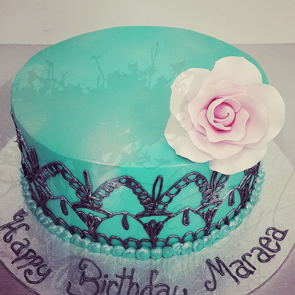 Smooth Blue Cake with Hand Piped Detailing