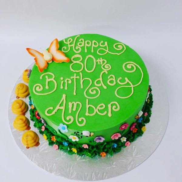 Smooth Green Garden Cake with Flowers and Bugs