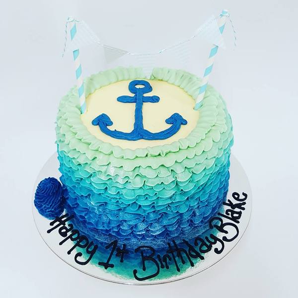 Blue Ombre Frill Cake with Piped Anchor and Bunting