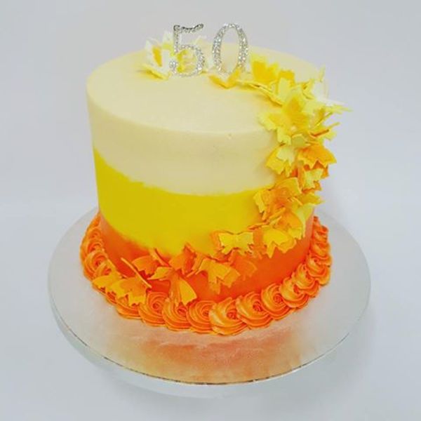 Smooth Three Colour Orange and Yellow Cake with Butterflies