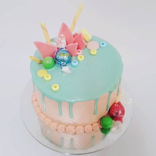 Light Pink with Pale Blue Drip and Pastel Toppings