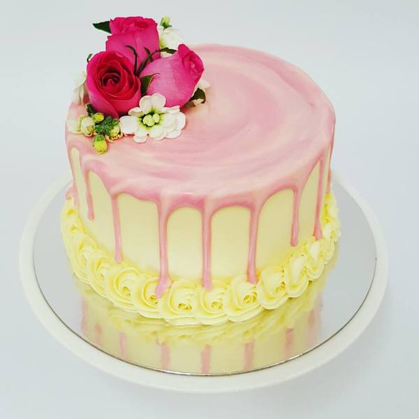 Smooth Cream Cake with Pink Marble Drip and Fresh Flowers